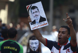 Spring leaders: a supporter of Egypt’s president Mohamed Mursi holding his poster during a demonstration in Tahrir Square in Cairo