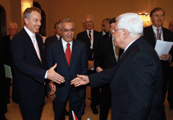Political solutions: President Mahmoud Abbas (r) greets Tony Blair and MP Salam Fyad at the Palestine Investment Conference