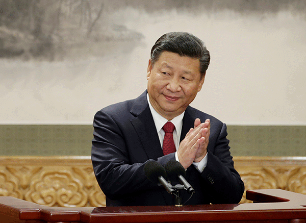Xi-Jinping-clasps-hands-R-600