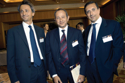 Wind Chairman Naguib Sawiris, centre, with former chief executive officer Paolo Dal Pino, left, and new CEO Luigi Gubitosi, considered to be the key figure in securing Sawiris the funding he needed