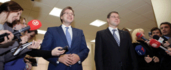 Riga mayor Nils Usakovs (left) and Latvia’s prime minister, Valdis Dombrovskis of the Unity bloc: election reduces political risk