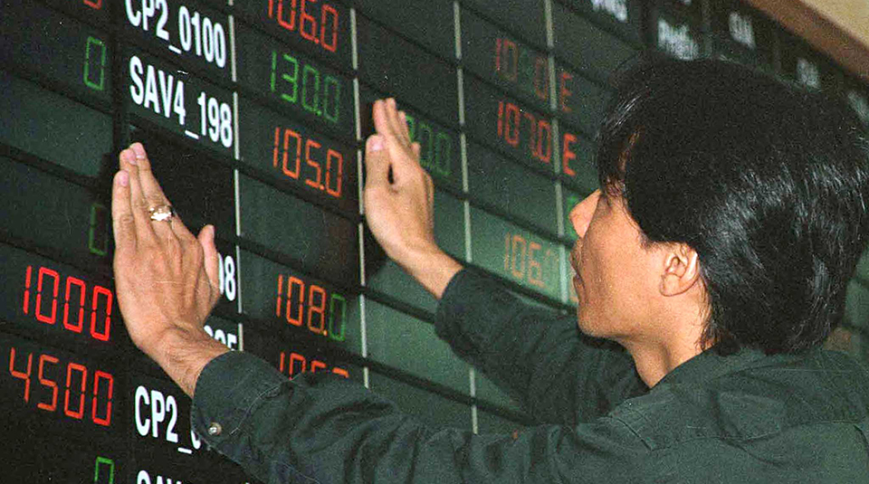 WORKER APPLIES FINISHING TOUCHES AT STOCK EXCHANGE IN HO CHI MINH CITY.